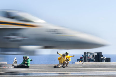Sailors launch an F/A-18E Super Hornet aboard the aircraft carrier USS Harry S. Truman.