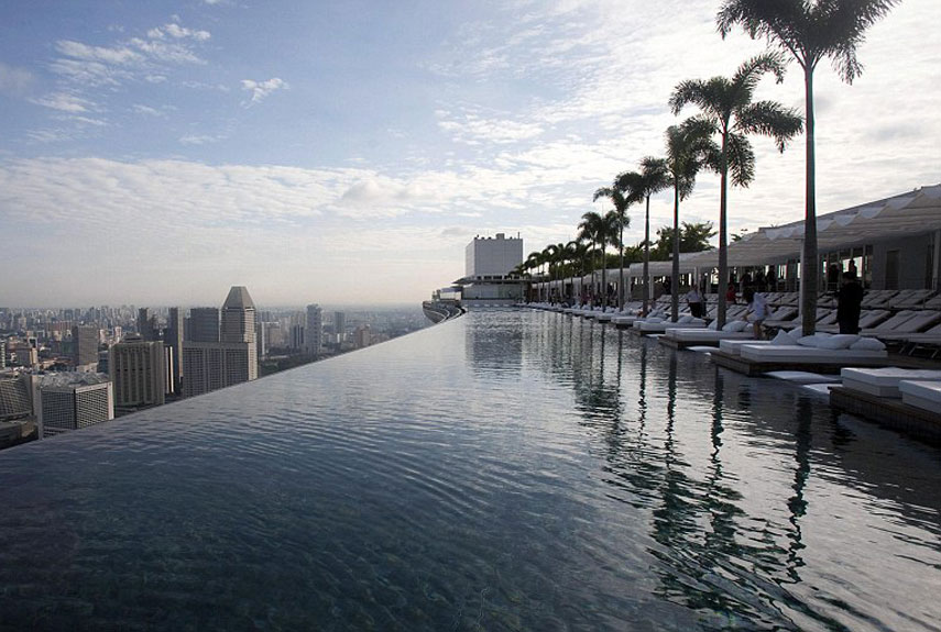 Where: Singapore<br /><br />
Singapore's SkyPark at the Marina Bay Sands offers an infinity pool with a first-class view—55 stories up. Perched atop the three towers of the world's most expensive hotel, the water seamlessly flows over the edge, into a catchment and back into the pool. The pool itself touches all three buildings and is longer than the Eiffel Tower laid on its side.<br /><br />